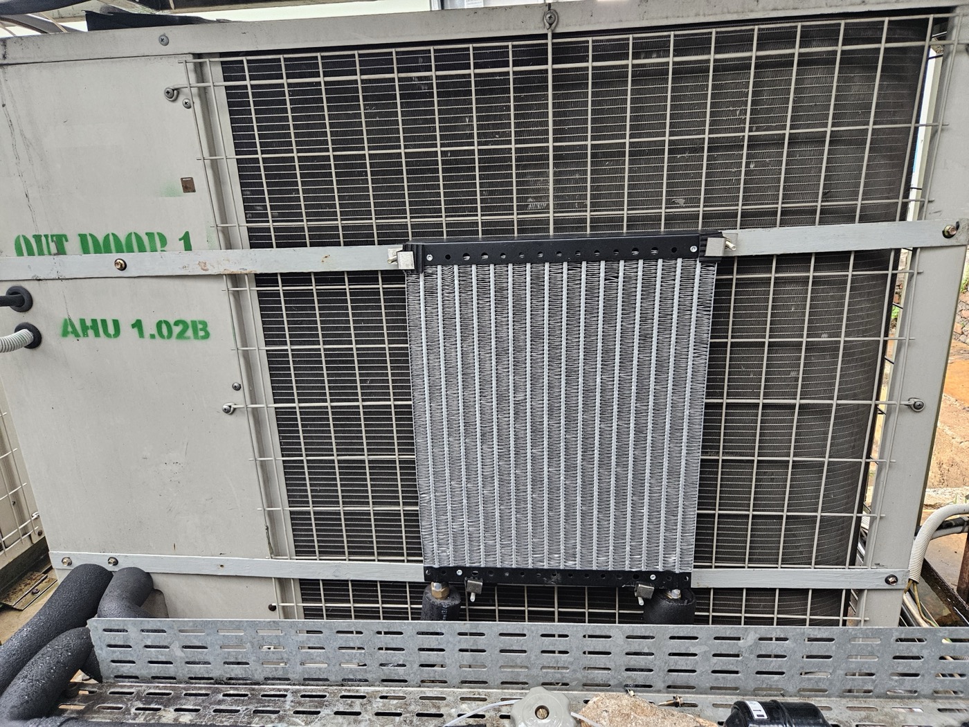 ESP heat-exchange panel installed on the rooftop condenser at this site